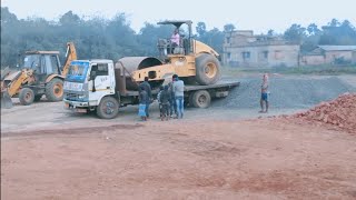 Loading Road roller into truck