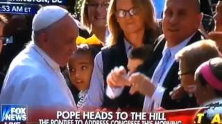 Pope Francis hugs boy then security breaks hug with big man