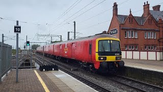 Royal Mail Train Class 325 passes Wigan North Western