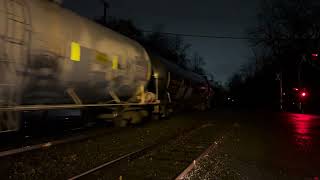 CSX 3219 ES44AH leads CSX M404 through Piscataway