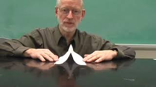 Blowing Into a Wedge Shaped Paper