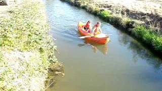 Dex and Ivy rafting down the irrigation ditch