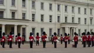 The Bearskins Military Brass Band is playing "Fly me to the moon" at Wellington Barracks, London