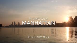 Manhattan rising sun, Skyline in silhouette.