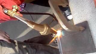 Hanna hands on oxygen acetylene welding cutting torch.