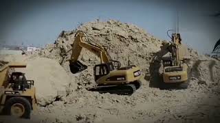 EXCAVATOR DUMP TRUCK DIGGING LIMESTONE ON CONSTRUCTION