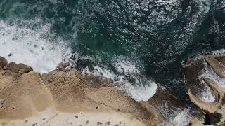 Waves Crashing On A Rocky Mountain