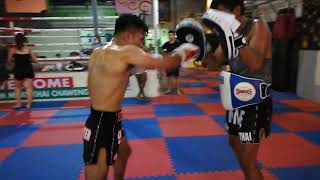 Meechai punching speed with Kru Iang.