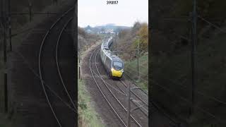 390117 tilting as it passes Forton, south of Lancaster