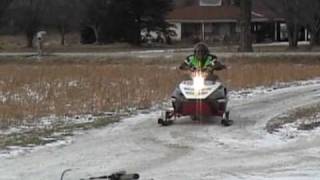 Polaris 700 2000 snowmobile on dirt ice take off 0-100