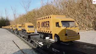 So Many Small Delivery Trucks Are Carried By HO Scale Model Train