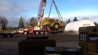 Unloading a 657 scraper in the yard