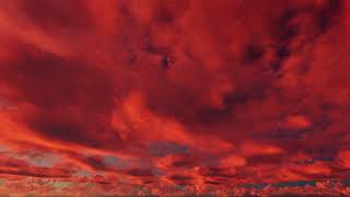 ( CGI 4k Stock Footage ) Fiery hot red sunset clouds time lapse seamless loop