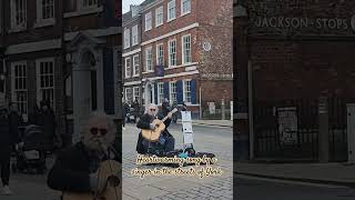 The moment capturing song by a singer in the streets of York, UK