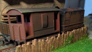 Weathering a boxcar and brake car for the abandoned engine shed