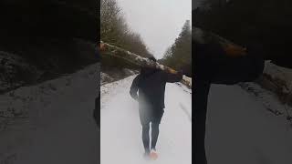 log carrying trail run in the snow