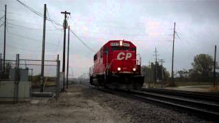 HD: Solo Canadian Pacific GP38-2 in the rain at Bensenville Il.