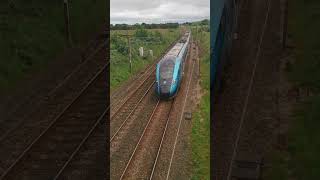 802216 Speeds below Green Lane bridge at Barton on the WCML