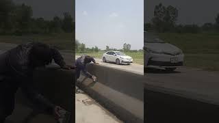 Two poor men are building a footpath.