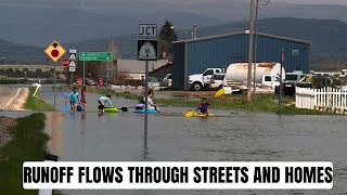 Runoff flows through Woodruff streets and homes