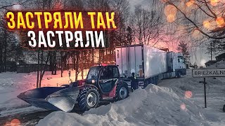 Вытягивают трактором. Застряли на фуре в Латвии.