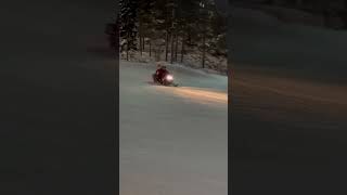 Skiing ride by snowmobile