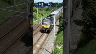 68018 thunders along the WCML south of Lancaster