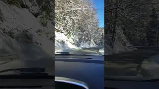 Driving in beautiful snow roads in Bulgaria while snowing