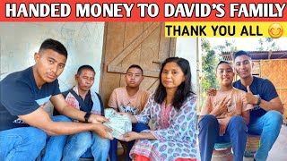 Handed money to David Family