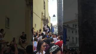 People trying to pick the ham on top #latomatina #spain #2024 #food #festival #tomatofestival(3)