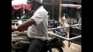 Cambodians pack their motos full!