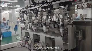 Automatic medical IV transfusion extension connecting tube coiling PE bag sealing packaging machine