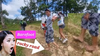 Barefoot hiking rocky road in the mountain of the philippines