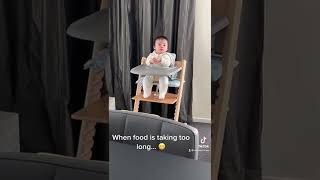 Baby waiting for food on highchair