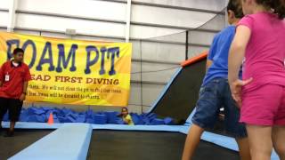 Miquela and Makoa jumping in the foam pit