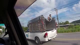 Guy kicking back on Trucks Roof [Phuket, Thailand]