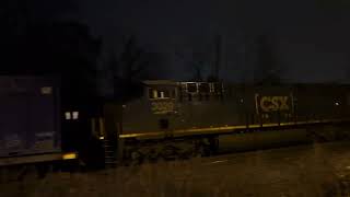 CSX 3077 ES44AH leads CSX M409 through Piscataway