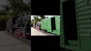 Steam Engine Toy Train Pullying Goods Wagon With Sliding Side Doors On HO Scale Model Railroad Track