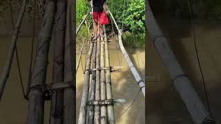 We crossed the river with a bamboo bridge