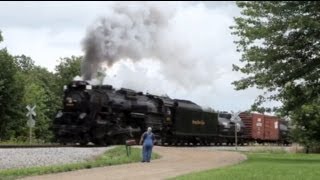 Steam locomotive NKP #765 passes a farmer getting the morning mail