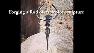 Forging a Rod of Asclepios sculpture