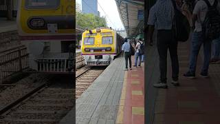 Mumbai local arriving at Dadar station