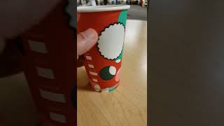 Hot coffee at Starbucks with Christmas theme paper cup.