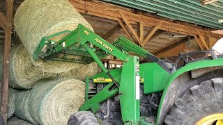 Stacking and storing the first cutting of hay.