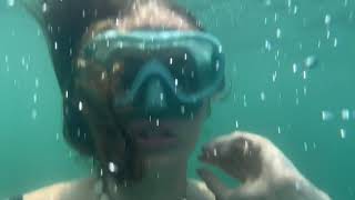 Girl makes underwater bubbles slow motion