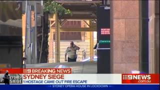 3 hostages flee Sydney cafe Monday, 2 from the front door.