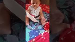 For the first time the child is playing with rice