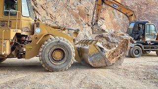 Volvo Excavator . SAMSUNG Excavator And Two Caterpillar Wheel Loaders Working On Mining Sites