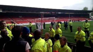 Pompey vs notts forest. Players hanging banner