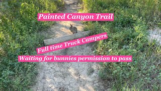 Full Time Truck Campers hiking the Painted Canyon Trail at Theodore Roosevelt National Park.